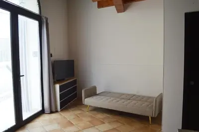 a living room with a couch in front of a tv at Casa Vacanza 