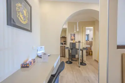 a kitchen with a table and chairs in a room at Damas Home in Palermo