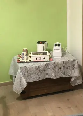 a table with a tea sign on top of it at Orologio21-Soggiorna al teatro Massimo in Palermo