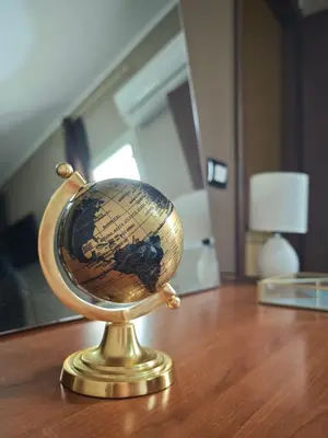 a gold globe sitting on top of a table at Casa Pitrè in Palermo