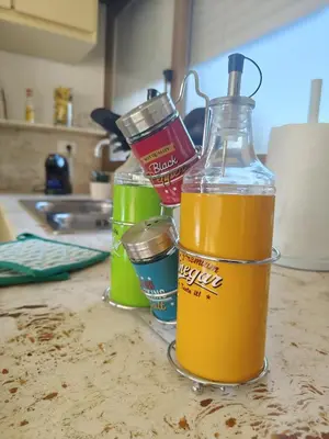a bottle of orange juice sitting on top of a counter at Quintadecima Rooms in Palermo