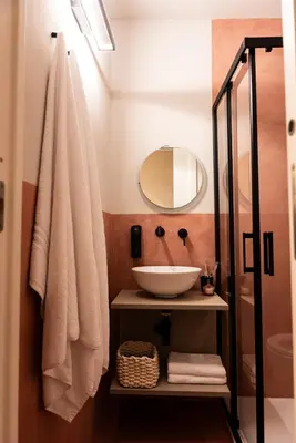 a bathroom with a white sink and a mirror at Chiave di Volta luxury suite e rooms in Palermo