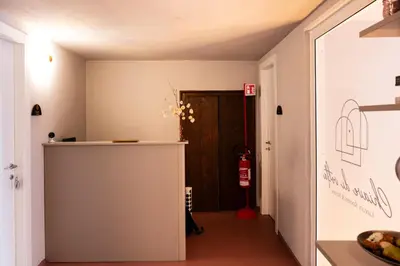 a hallway with a door leading to a room at Chiave di Volta luxury suite e rooms in Palermo