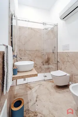 a bathroom with a shower and a toilet and a sink at Nuovissimo Appartamento nel Cuore di Palermo in Palermo