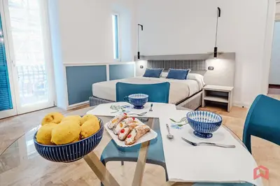 a room with a bed and a table with food on it at New Holiday Home in Palermo in Palermo