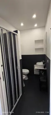 a bathroom with a toilet and a sink at La Riali in Palermo