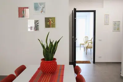 a potted plant sitting on a table in a living room at Appartamenti Marì 1 in Palermo