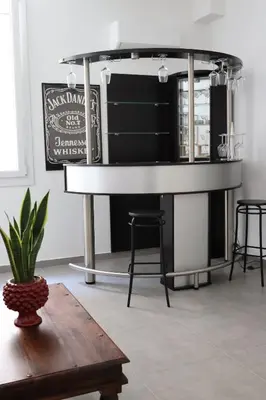 a dining room table with a black and white counter at Appartamenti Mari' 2 in Palermo