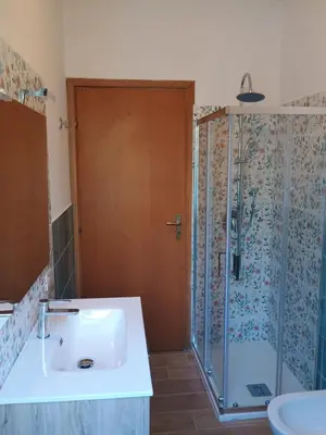 a bathroom with a shower and a sink and a shower at Il Giardino di Lia in Palermo