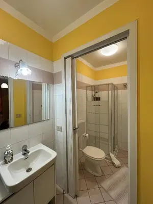 a bathroom with a toilet and a sink and a shower at Monolocale Signorile in Castellammare del Golfo