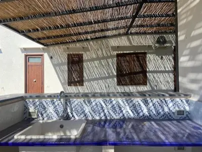 a bathroom with a sink and a roof at I Carrubi in Lascari