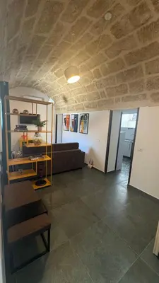 a living room with a couch and a table at Casarkeb in Terrasini