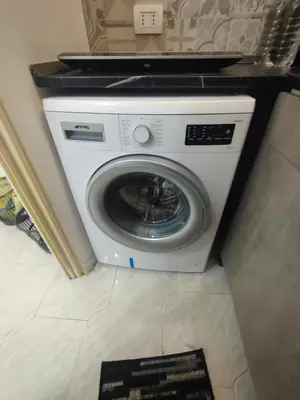 a white washing machine sitting in a room at Corso Butera 489 in Bagheria