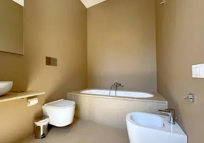 a bathroom with a tub and a toilet and a sink at Solemar Sicilia - Villa Regina Elena in Palermo