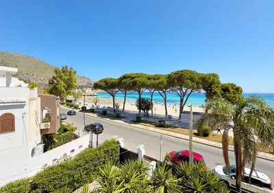a view of the beach from the balcony of a building at Solemar Sicilia - Villa Regina Elena in Palermo