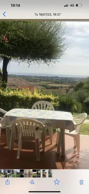 a white table and two chairs sitting on a patio at Residenza Uliveto in Monreale