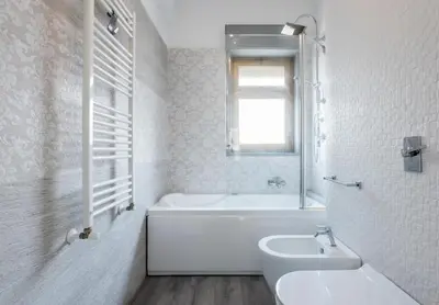 a white bathroom with a tub and a sink at Guest House Conca D'oro in Palermo