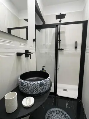 a bathroom with a large bowl sink on a counter at La Stanza del Viaggiatore in Palermo