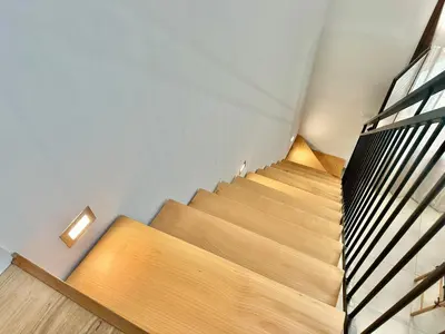 a staircase in a building with a wooden floor at Loft Pergola, posizione strategica in Castellammare del Golfo