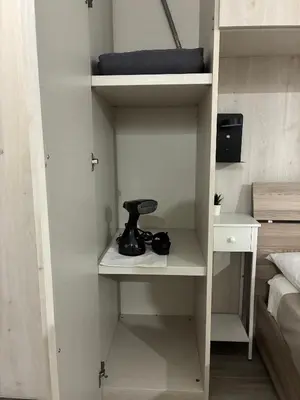 a cupboard with a mortar and pestle in a bedroom at Mamma Chica Alloggio Turistico a Palermo in Palermo