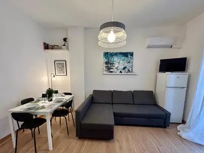 a living room with a couch and a table at Charlotte in Palermo