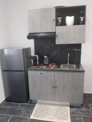 a small kitchen with a sink and a refrigerator at Suite Nobile in Palermo