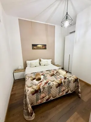 a bedroom with a large bed in a room at 30House in Palermo
