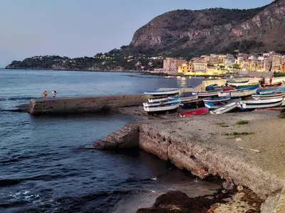 a group of boats on the shore of a beach at Casa Mirella in Aspra