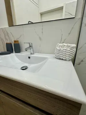 a white sink in a bathroom with a mirror at Casa di Anna in Palermo