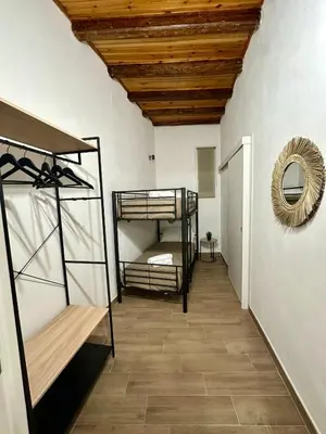a room with two bunk beds and a mirror at Casa di Anna in Palermo