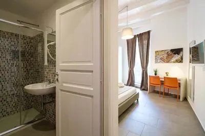 a bathroom with a shower and a sink and a toilet at B&B Cala Peppa in Palermo