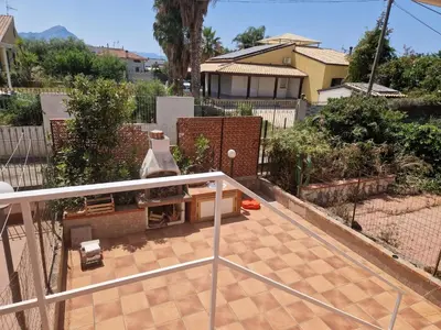 a view of a patio from the balcony of a house at Silville in Campofelice di Roccella