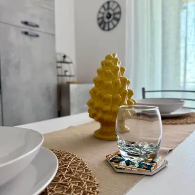 a bedroom with a bed with white towels on it at Castellammare Residence in Palermo