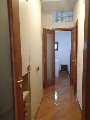a hallway with a door leading to a bathroom at CASA di VIA PITRE' 29 in Palermo