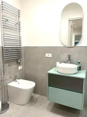 a bathroom with a sink and a mirror at Toselli 32 in Palermo