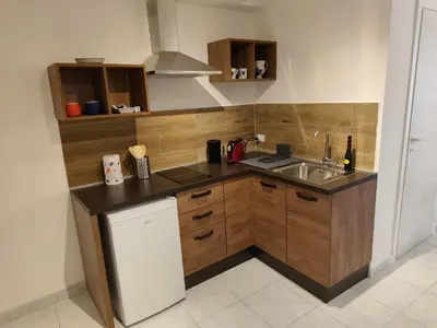 a kitchen with a sink and a counter top at A Calat'i Jurici in Palermo