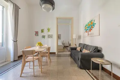 a living room with a couch and a table at Casa Markea by Wonderful Italy in Palermo