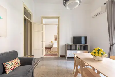 a bedroom with a white bed and a window at Casa Markea by Wonderful Italy in Palermo