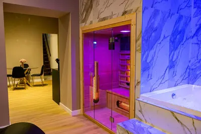 a bathroom with a tub with purple lighting at GM Luxury Apartment in Palermo