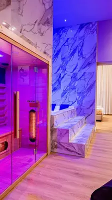 a room with two beds and purple lighting at GM Luxury Apartment in Palermo