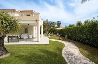 a house with a pathway leading to a yard at Luxury Hot tub Swimming pool Private pool Wi-Fi BBQ in Castellammare del Golfo