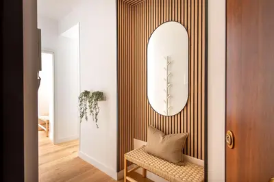 a living room with white cabinets and a table and chairs at Lo Jacono Apartments by Wonderful Italy in Palermo