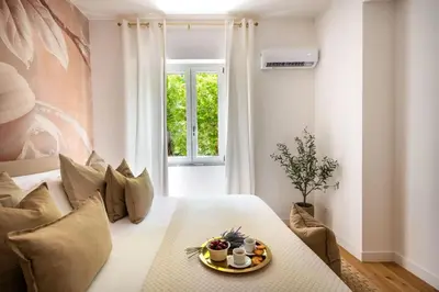 a living room with a couch and a table at Lo Jacono Apartments by Wonderful Italy in Palermo