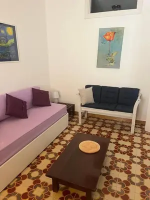 a living room with two couches and a coffee table at Blue Sea Apartment in Isola delle Femmine