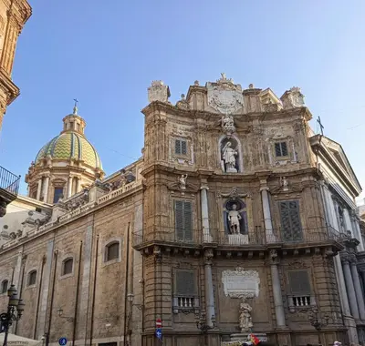 an old building with a clock on top of it at Diana ai Quattro Canti - centro storico Palermo in Palermo