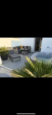 a living room with couches and potted plants at Dagma Spa Home Sicilia in Carini