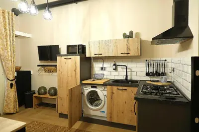 a kitchen with a washer and a washing machine at D'Halya 57 in Palermo