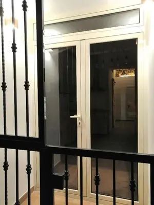 a glass door on a balcony with a railing at D'Halya 57 in Palermo