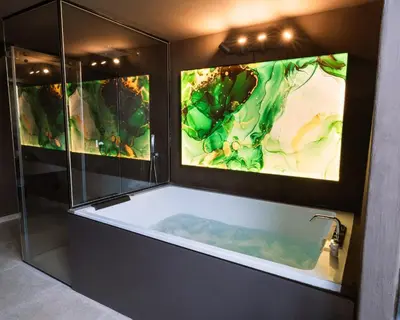 a glass room with a tub and a green chair at Cattedrale Suite in Palermo
