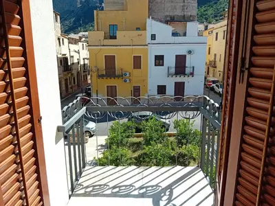 a view of a city with mountains in the background at Aurooms in Cinisi